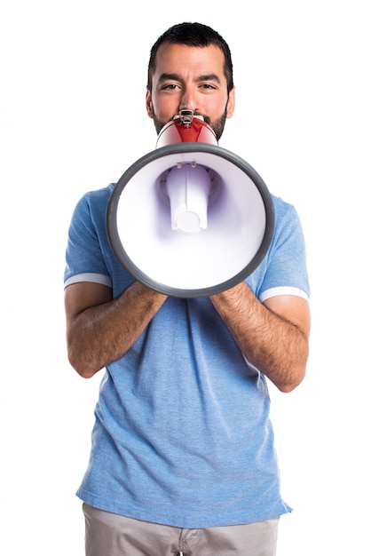 Man with blue shirt shouting by megaphone