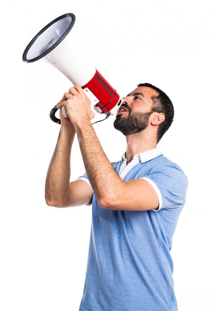 Man with blue shirt shouting by megaphone