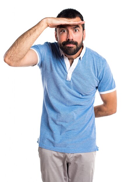 Man with blue shirt showing something