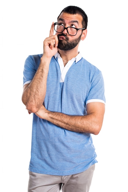 Man with blue shirt thinking