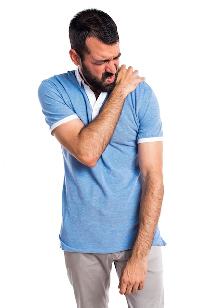 Man with blue shirt with shoulder pain