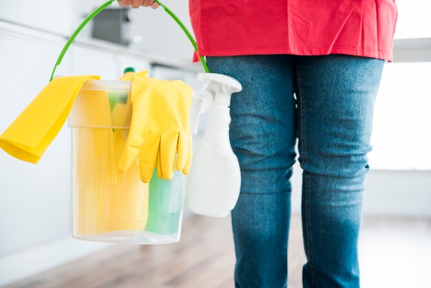 Man with bucket of cleaning products