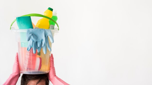 Man with bucket of cleaning products