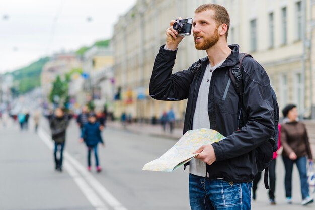 Man with camera and map
