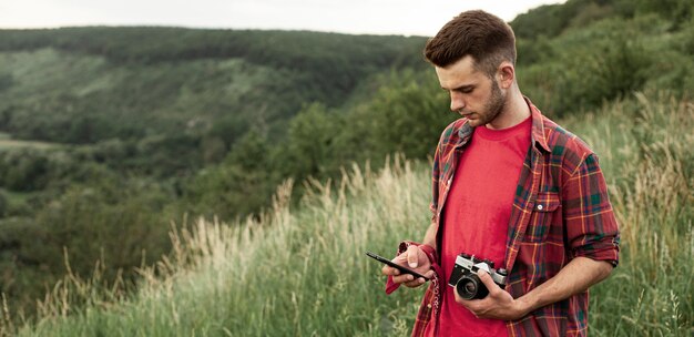 Man with camera in nature