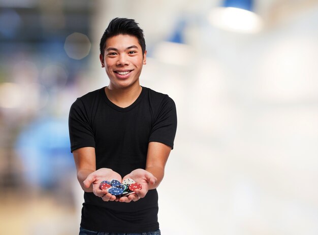 Man with casino chips in his hands