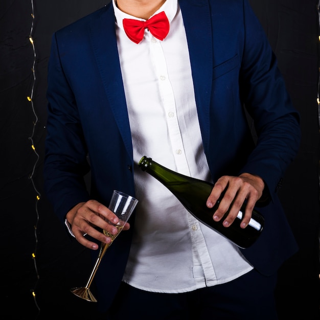 Man with champagne and glass