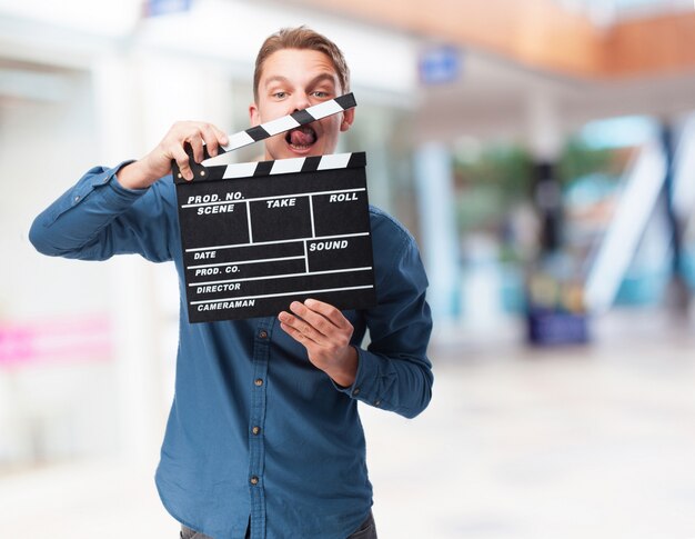 Man with a clapperboard