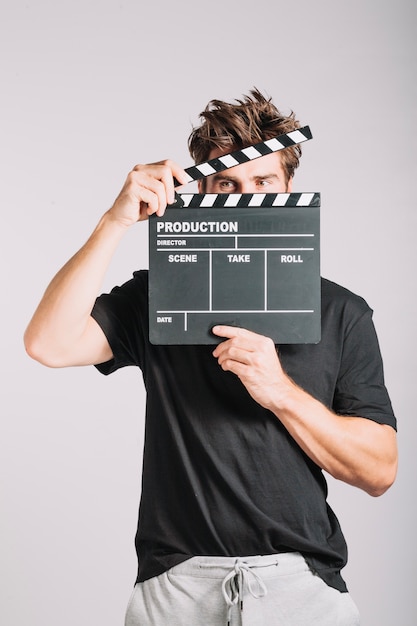Free photo man with clapperboard
