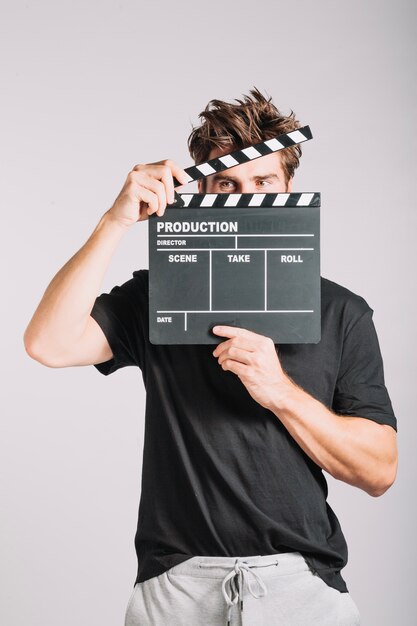 Человек с clapperboard