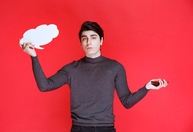 Man with a cloud shape thinkboard thinking