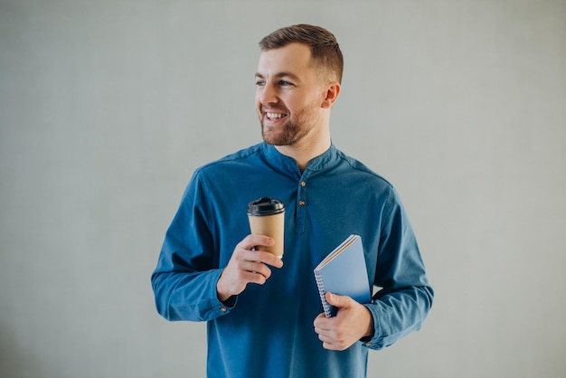 Man with coffee isolated in studio