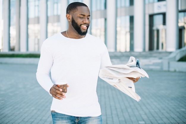 Man with coffee and newspaper