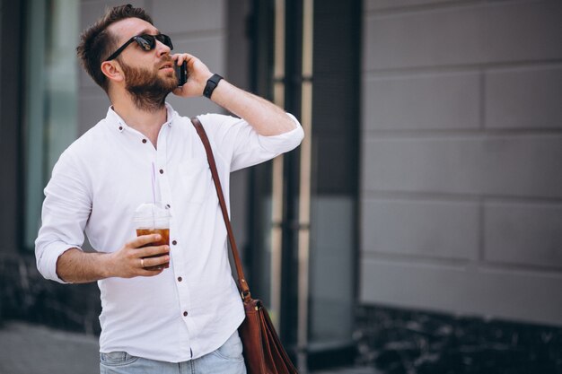 Man with coffee and phone