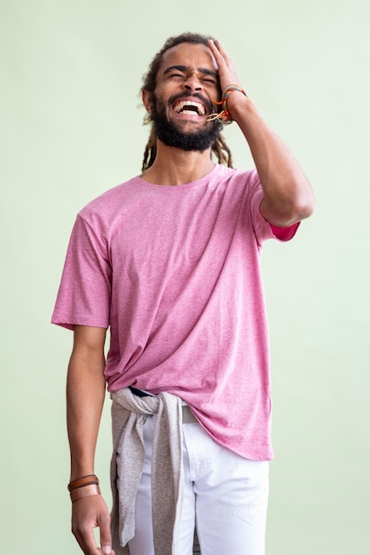 Free photo man with dreads laughing