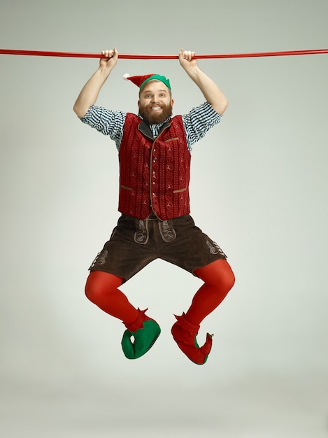 Man with elf costume isolated on white