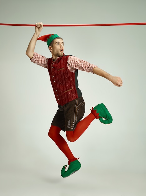 Man with elf costume isolated on white