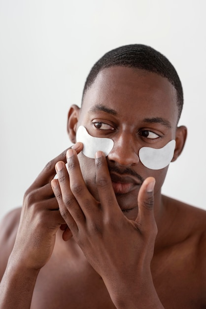 Man with eye patches close up