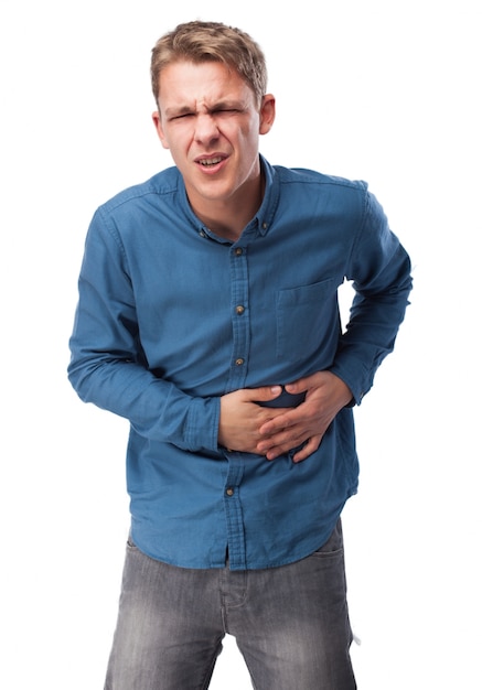 Man with face of pain touching his stomach