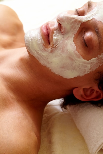 Man with a facial treatment