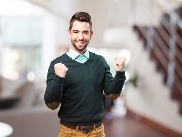 Man with fists raised celebrating