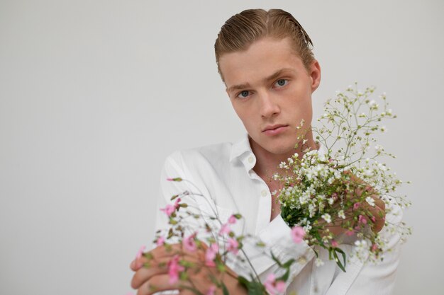 Man with flowers posing front view