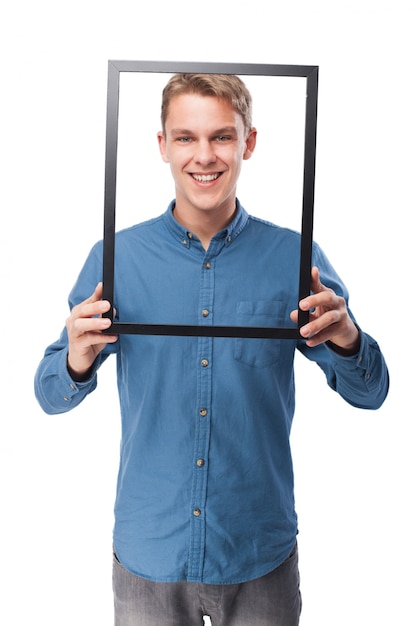 Free photo man with a frame