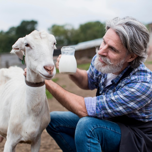 Man with fresh goat milk