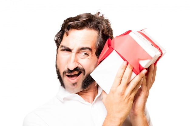Man with a gift in their hands trying to know what's inside