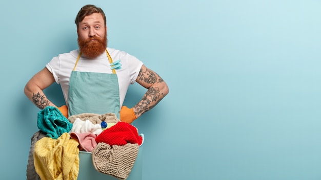 Man with ginger beard doing laundry