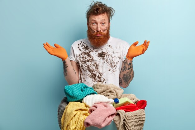 Man with ginger beard doing laundry