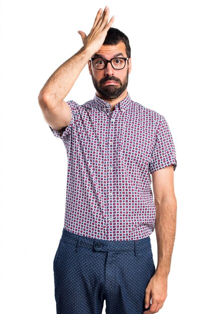 Man with glasses having doubts