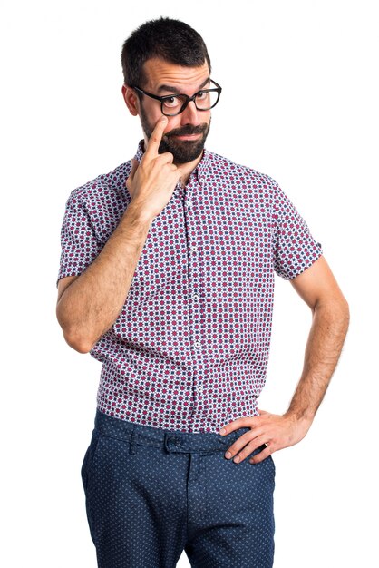 Man with glasses showing something