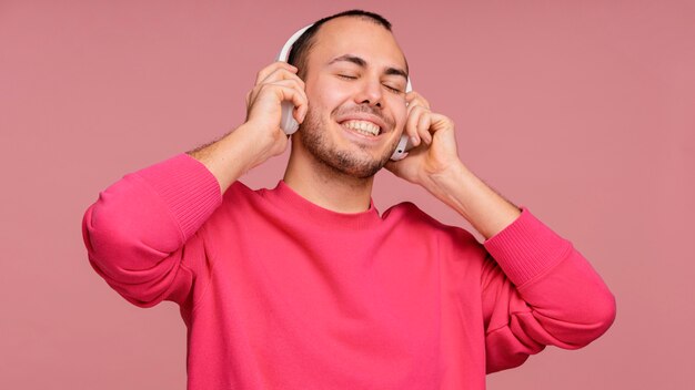 Man with headphones laughing