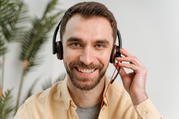Free photo man with headset having video call