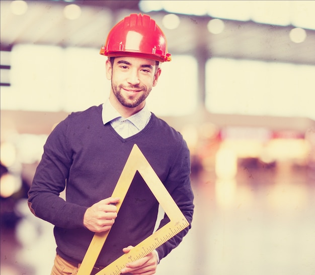 Man with a helmet and a bevel