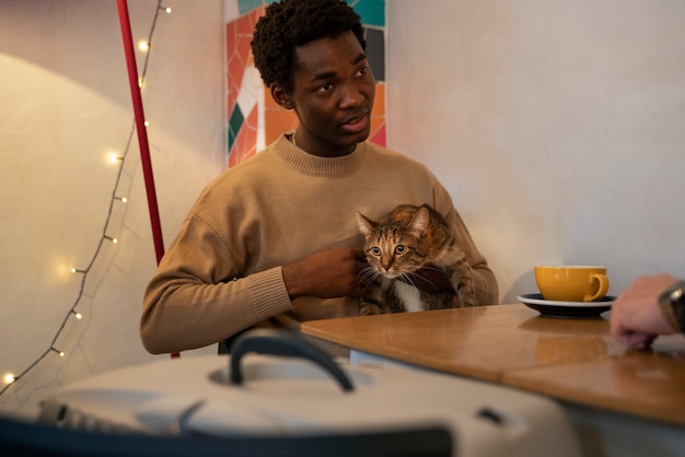 Man with his adorable pet cat