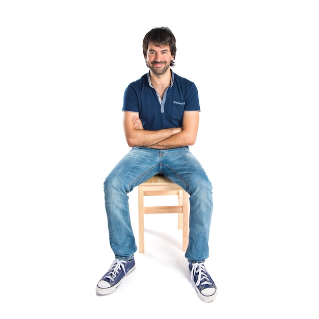 Free photo man with his arms crossed over white background