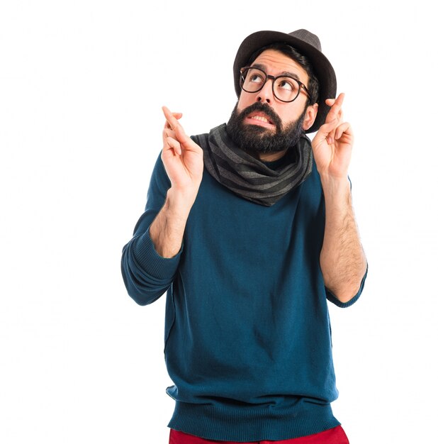man with his fingers crossing