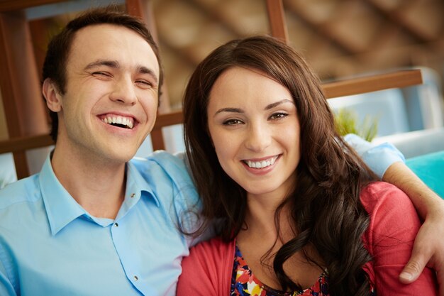 Man with his hand on his girlfriend's shoulder