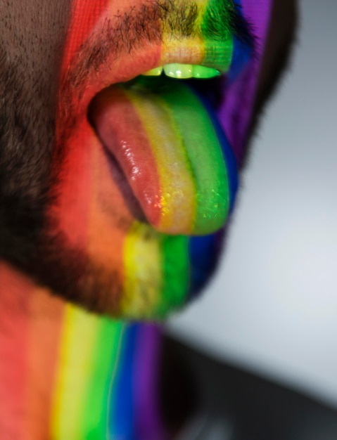 Man with his tongue out and lgbt symbol