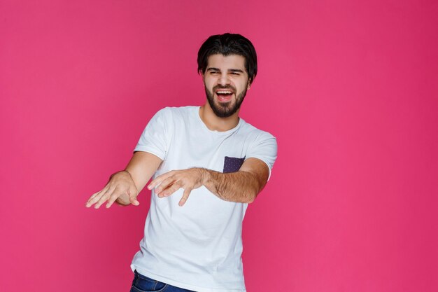 Man with joyful face feels high confidence and enjoys the moment. 