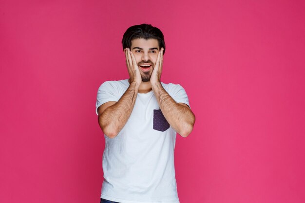 Man with joyful face feels high confidence and enjoys the moment. 