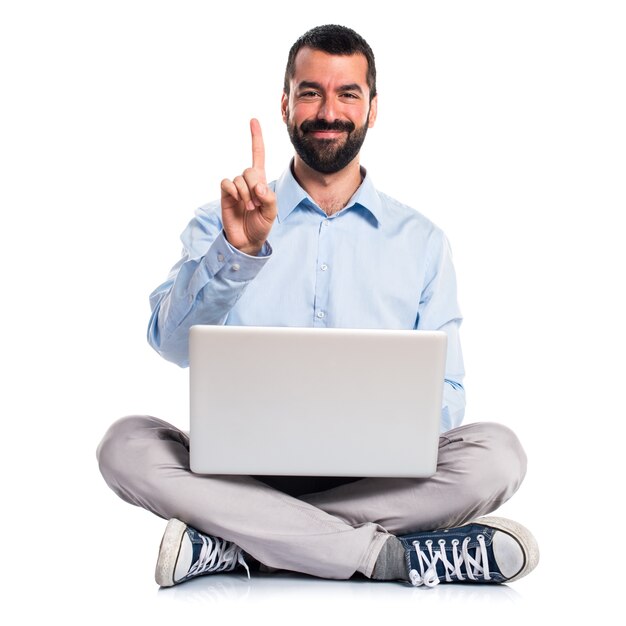 Man with laptop counting one