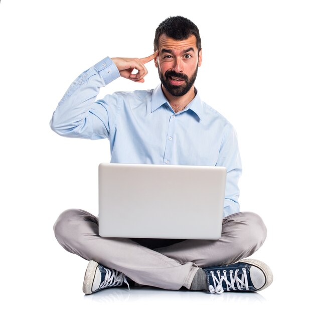 Man with laptop making crazy gesture