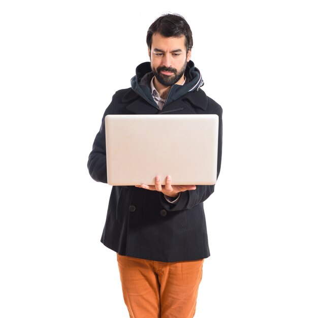 Free photo man with laptop over white background