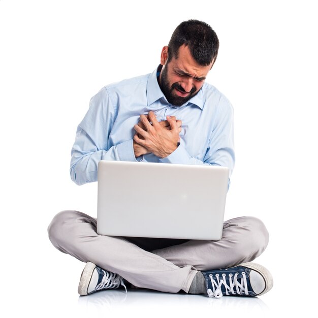 Man with laptop with heart pain