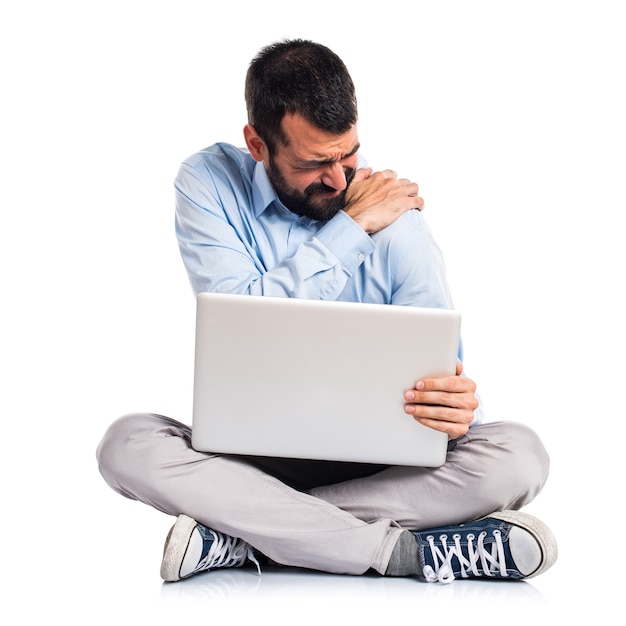 Man with laptop with shoulder pain