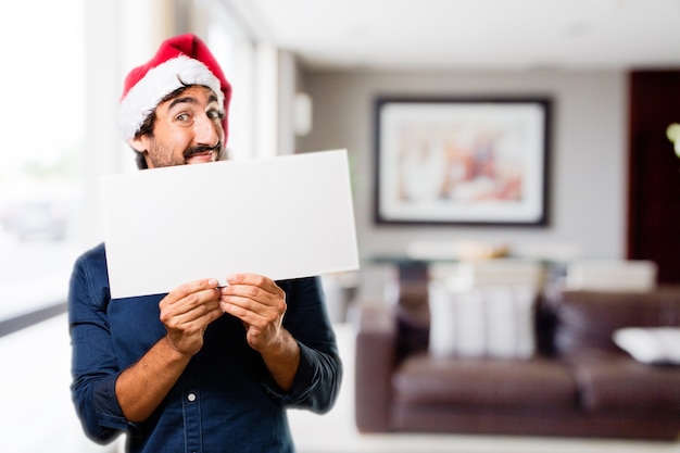 Free photo man with a large sign in a house