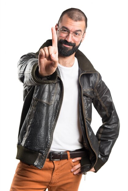 Man with leather jacket counting one